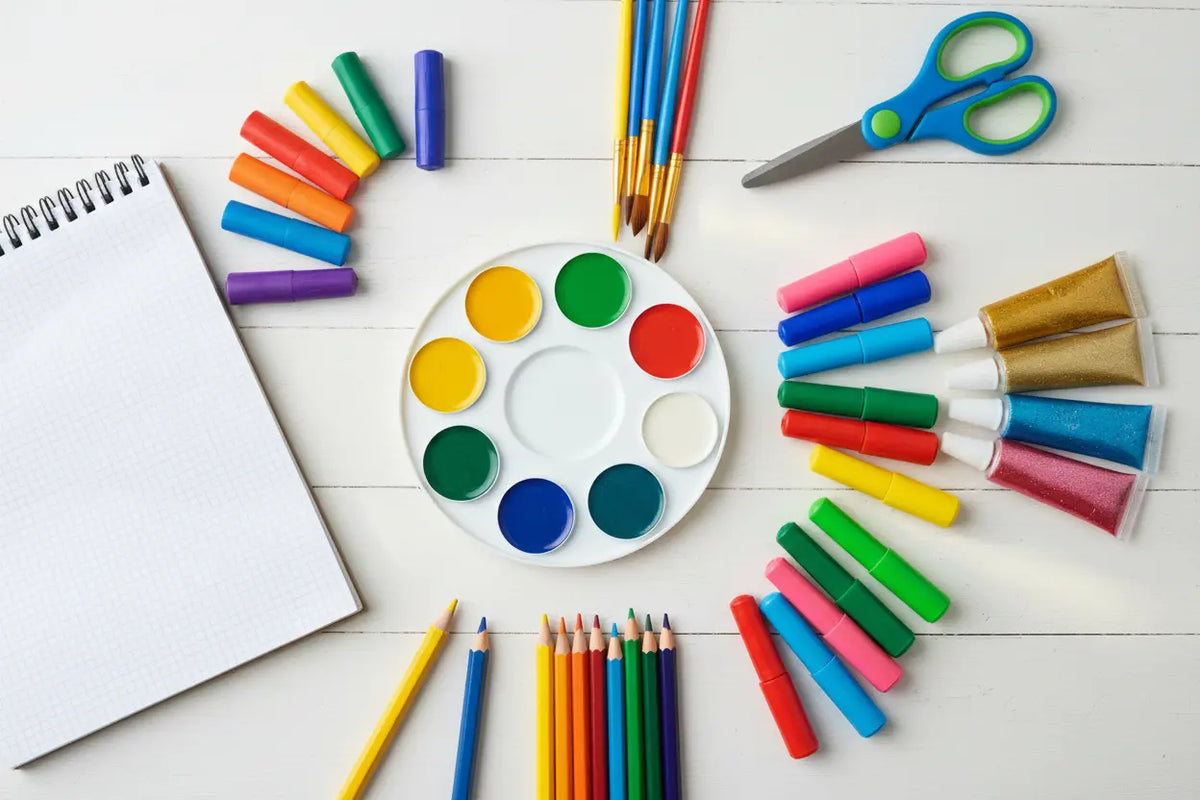 Art supplies for kids including watercolor sets, markers and complete art kits